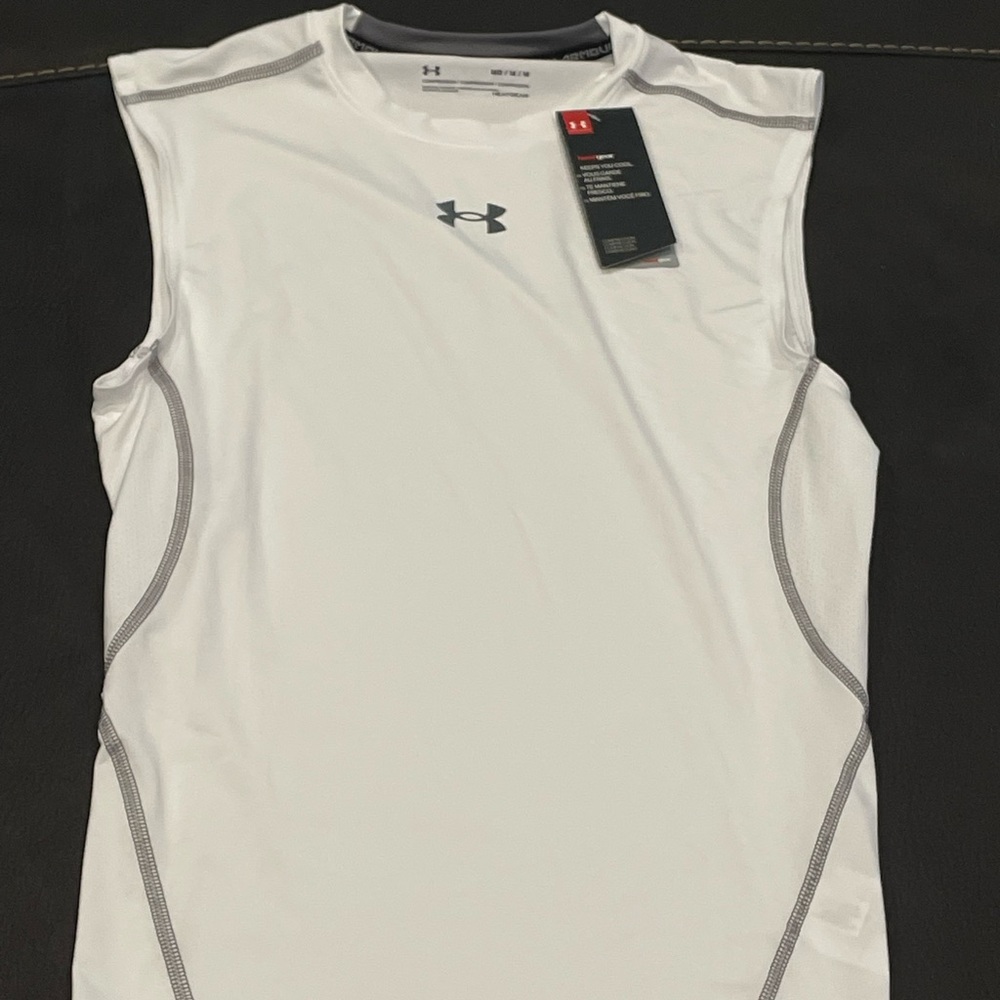 Under Armour sleeveless compression shirt. Brand new, never worn, tags still on.